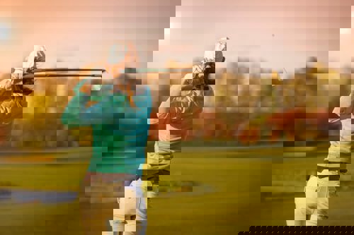 woman-swinging-golf-club